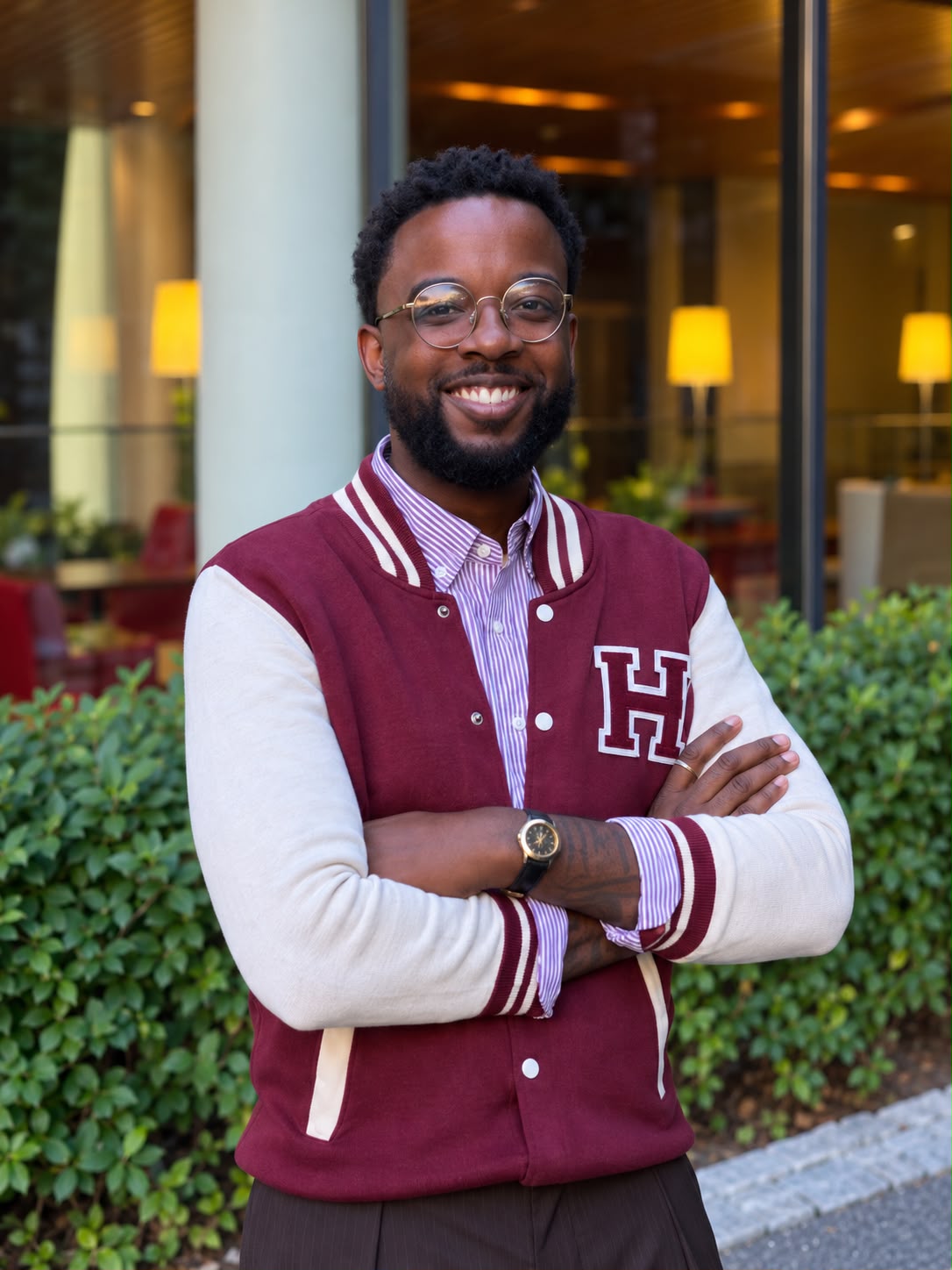Portrait of Andrew Herron in a Harvard varsity jacket