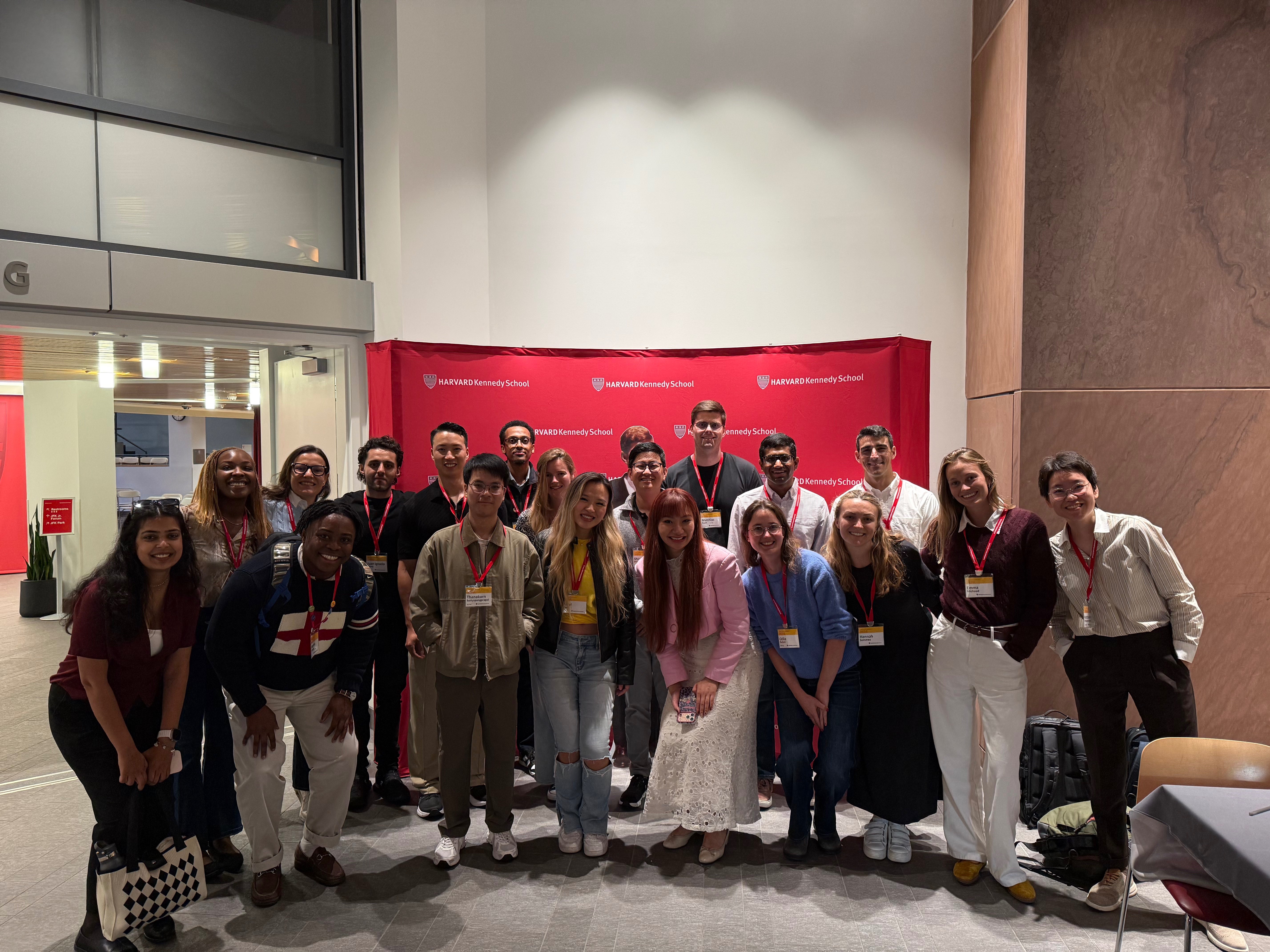 Xinyi with the MPA cohort in front of the Harvard Kennedy School banner