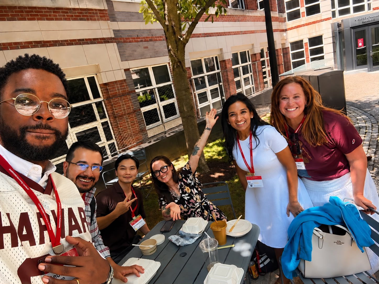 Andrew with friends at a courtyard lunch table