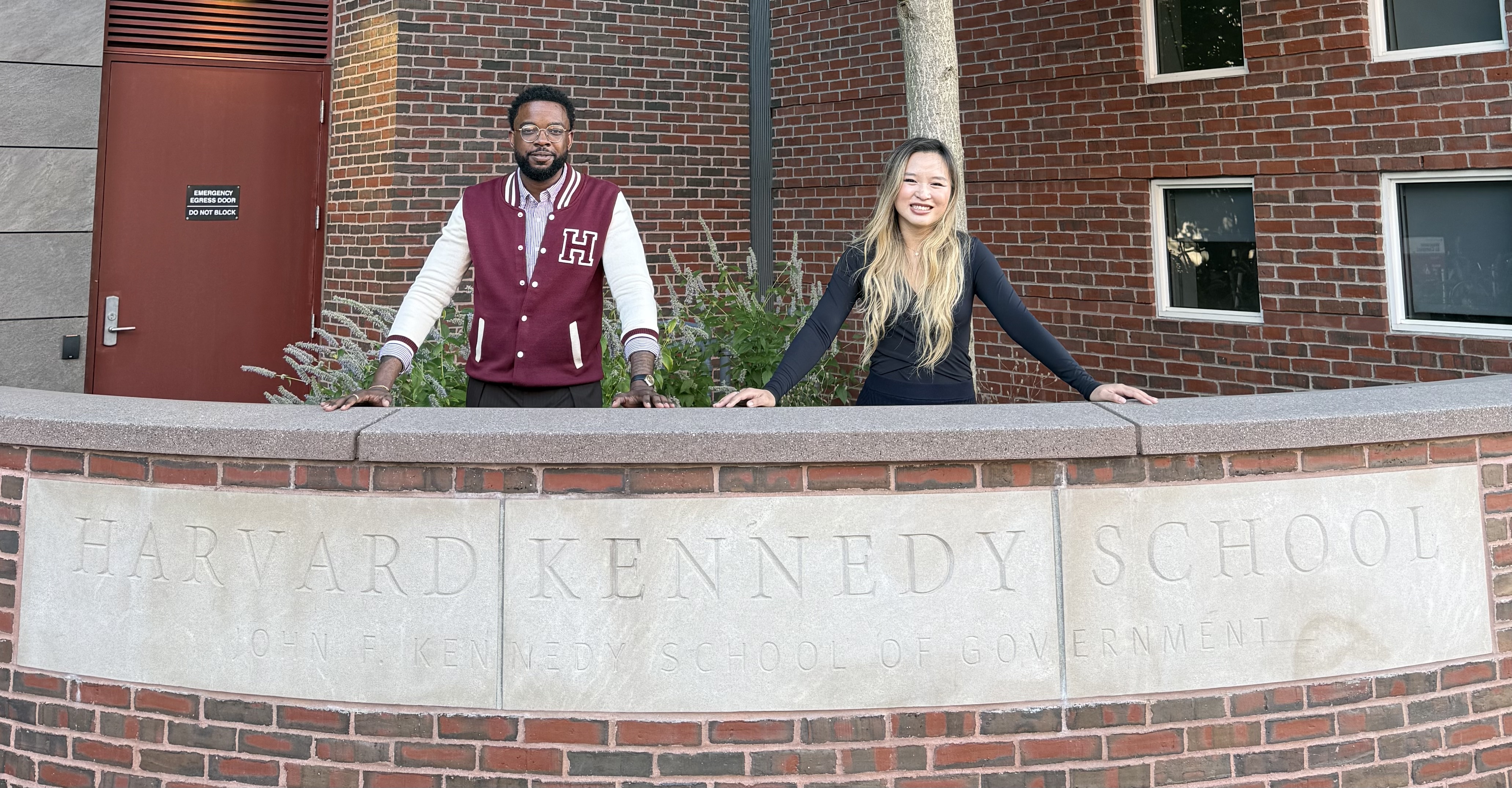 Xinyi and Andrew at the Harvard Kennedy School sign